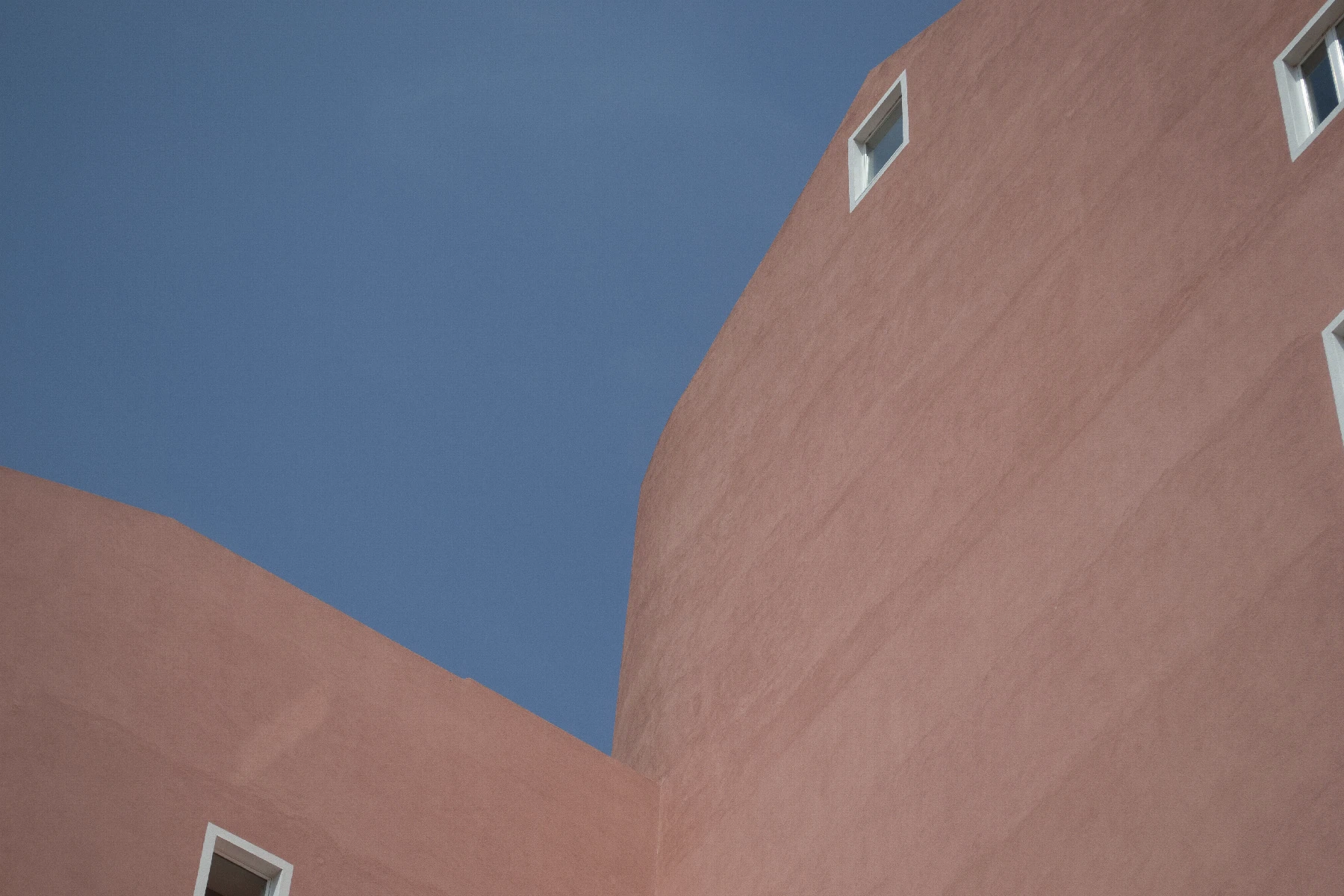 Photo of minimalistic pink buildings in Lisbon or Barcelona. Can't remember.