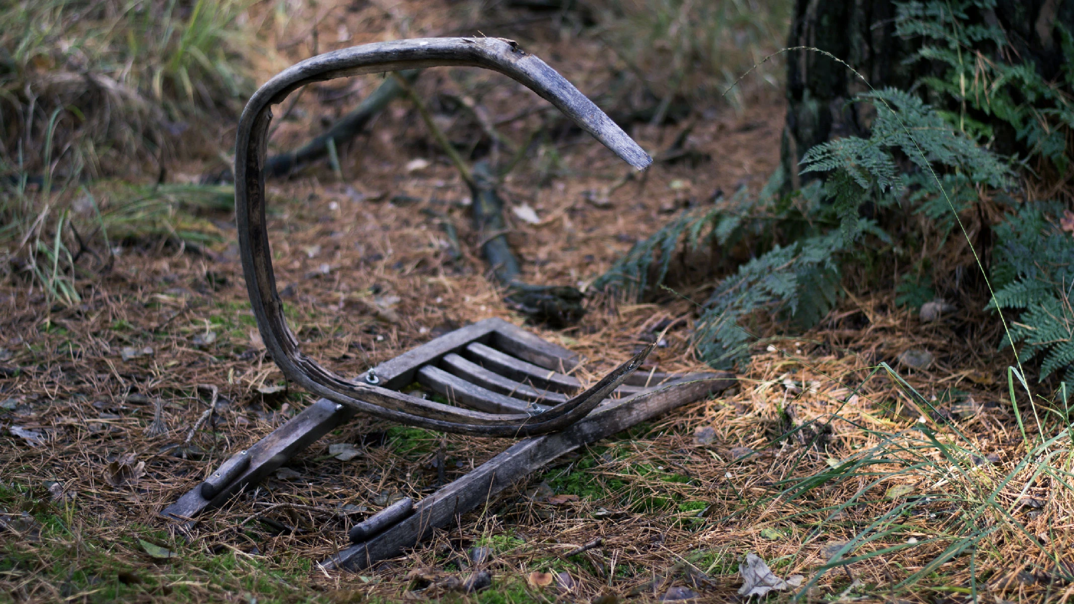 Photo of a broken chair wiht no seating.